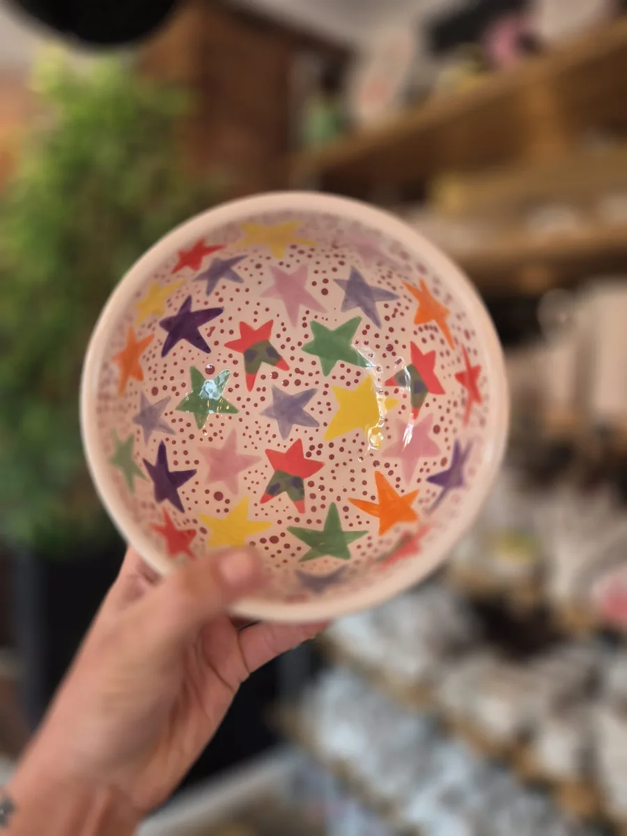Hand-painted colourful stars bowl at art-ful pottery café Worthing